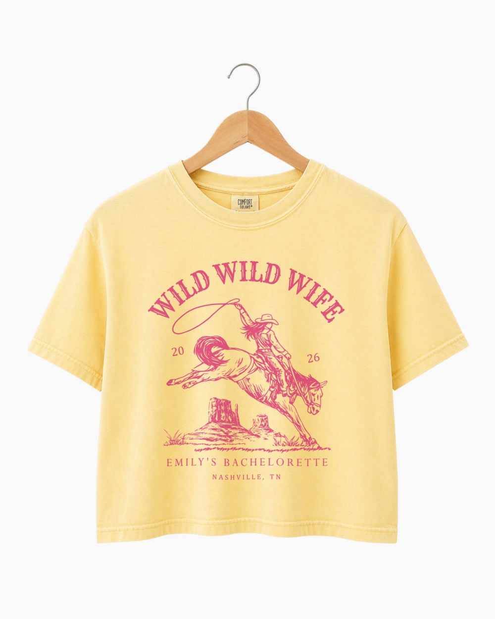 Personalized bachelorette crop top with bride name, year, and city on a vintage western rodeo design. Custom Wild Wild Wife cowgirl theme for the whole bridal crew.
