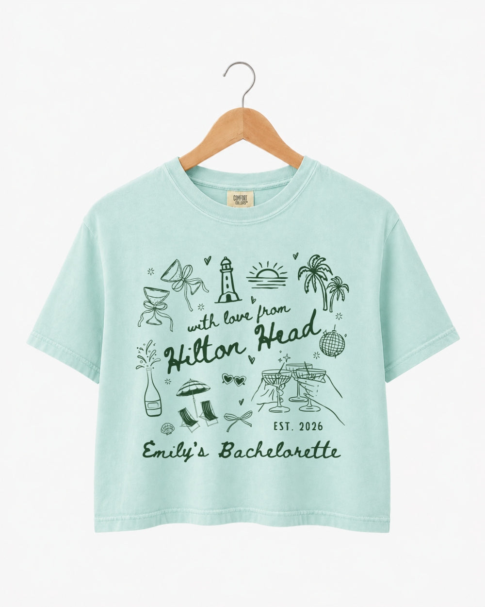 Gift idea for the bachelorette crew: Hilton Head crop top with playful line-art doodles and hand-drawn script. Personalized with bride name, destination, and EST year for the whole party.