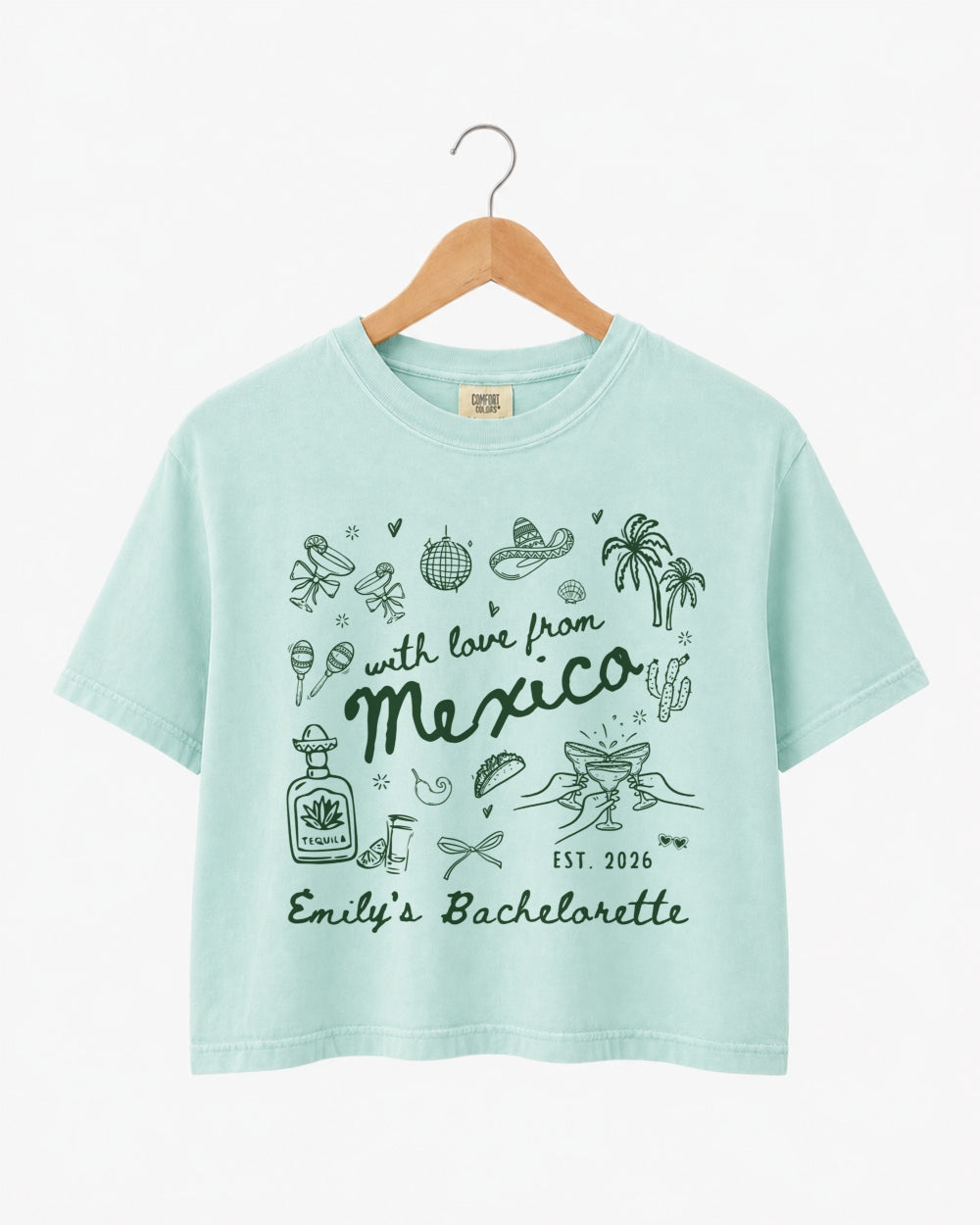 Gift idea for the bachelorette crew: Mexico destination crop top with playful hand-drawn script art. Personalized with bride name, date, and destination for the whole party.