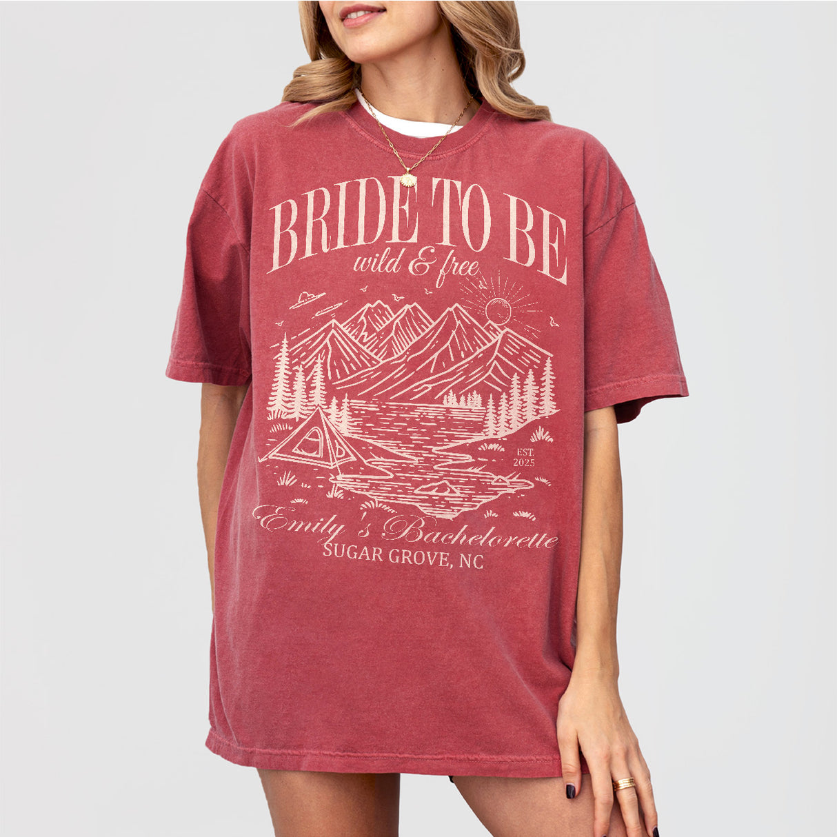 Crimson bachelorette party shirts for the bride-to-be with "Last Trail Before the Veil" camping theme for a wild and free mountain bach party
