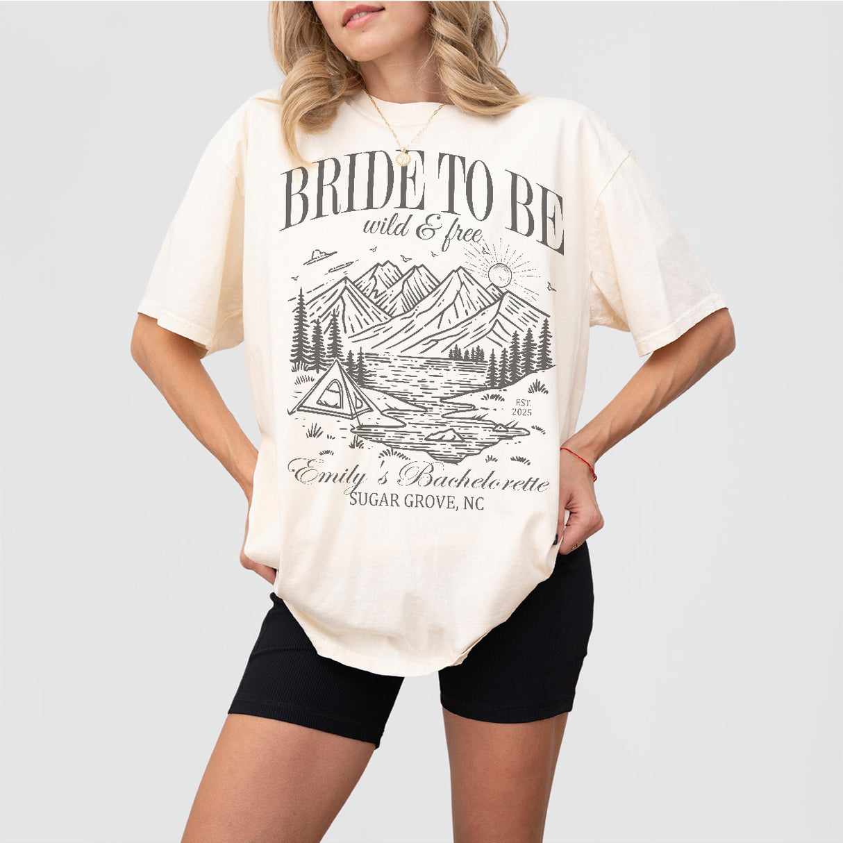 Ivory cotton shirts for the bride-to-be and bachelorette camping trip, featuring a Mountain Camp Bach Bride To Be Wild & Free design