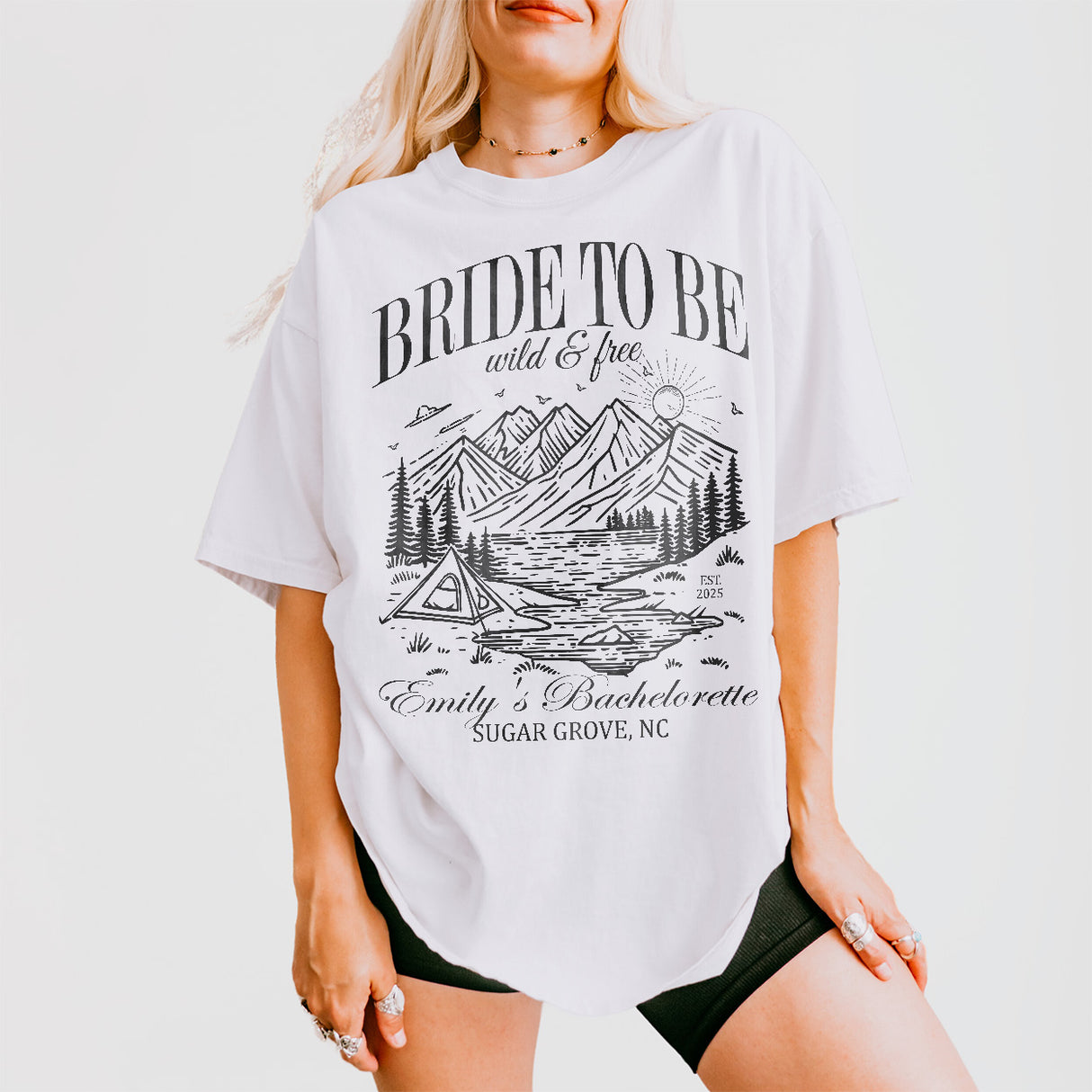 Custom white shirts for the bride-to-be to wear during bachelorette camping trips, featuring a witty "Last Trail Before the Veil" design