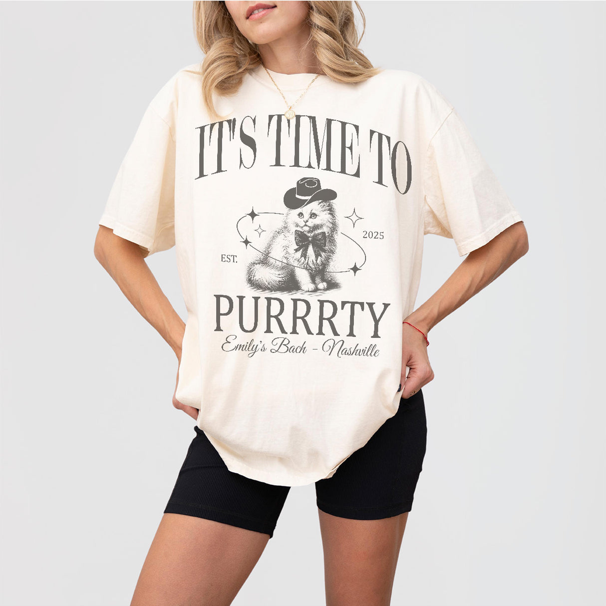 Ivory cotton bachelorette party shirt with a cat bride pun design, perfect for the bride-to-be or her cat loving bridal party