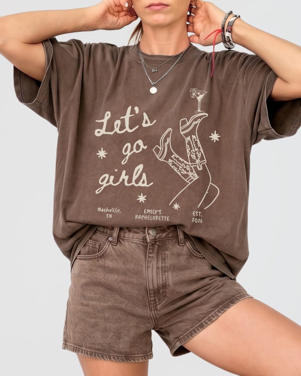 Bride and her girls night out crew in Let's Go Girls vintage line-art tees featuring cowboy boots and martini graphics. Matching bachelorette party shirts for the whole squad.