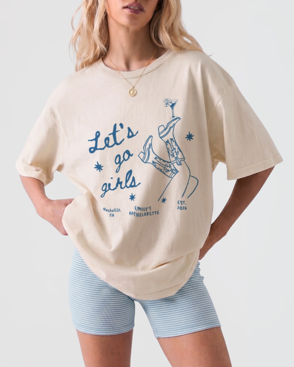 Vintage line-art girls night out tee with script lettering and cowboy boots and martini illustrations. Let's Go Girls theme, perfect for bachelorette parties, girls trips, and nights out with the crew.