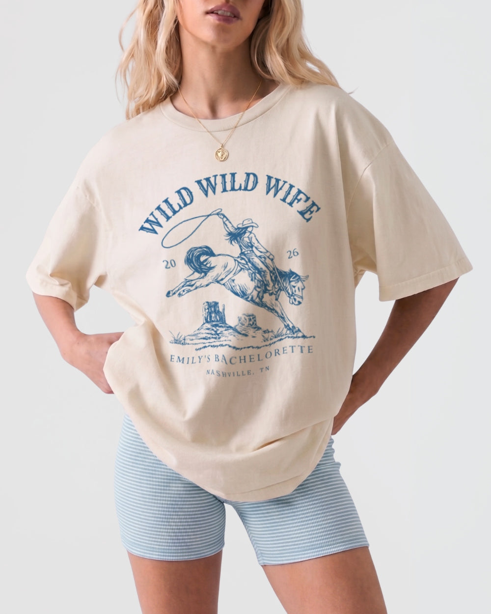 Vintage western distressed line-art bachelorette tee with Wild Wild Wife rodeo theme. Personalized with bride name, destination city, and weekend date for the full bachelorette crew.