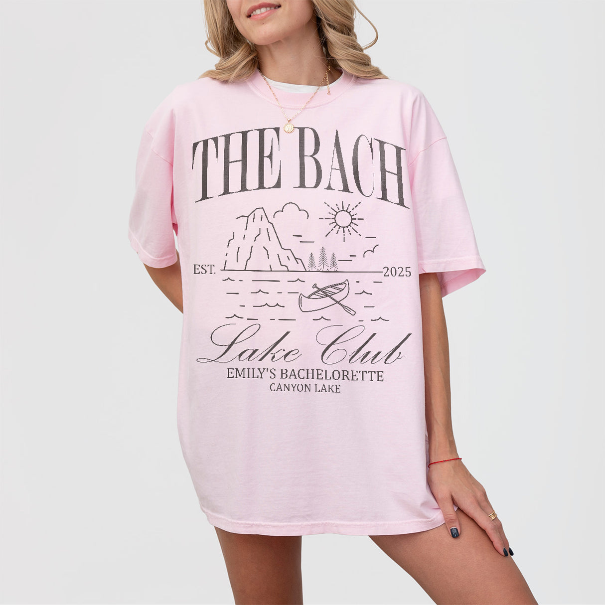 Soft pink custom bachelorette shirt perfect for outdoor adventures like hiking, kayaking, or camping with the bride tribe at a mountain lake cabin