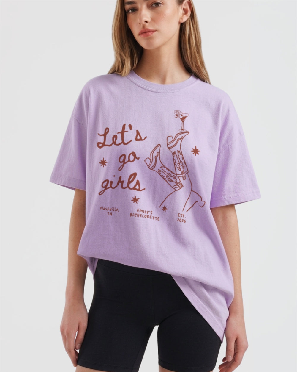Matching shirts for a girls night out with vintage line-art boots and martini graphics. Let's Go Girls script tee for bachelorette parties, girls trips, and nights on the town.