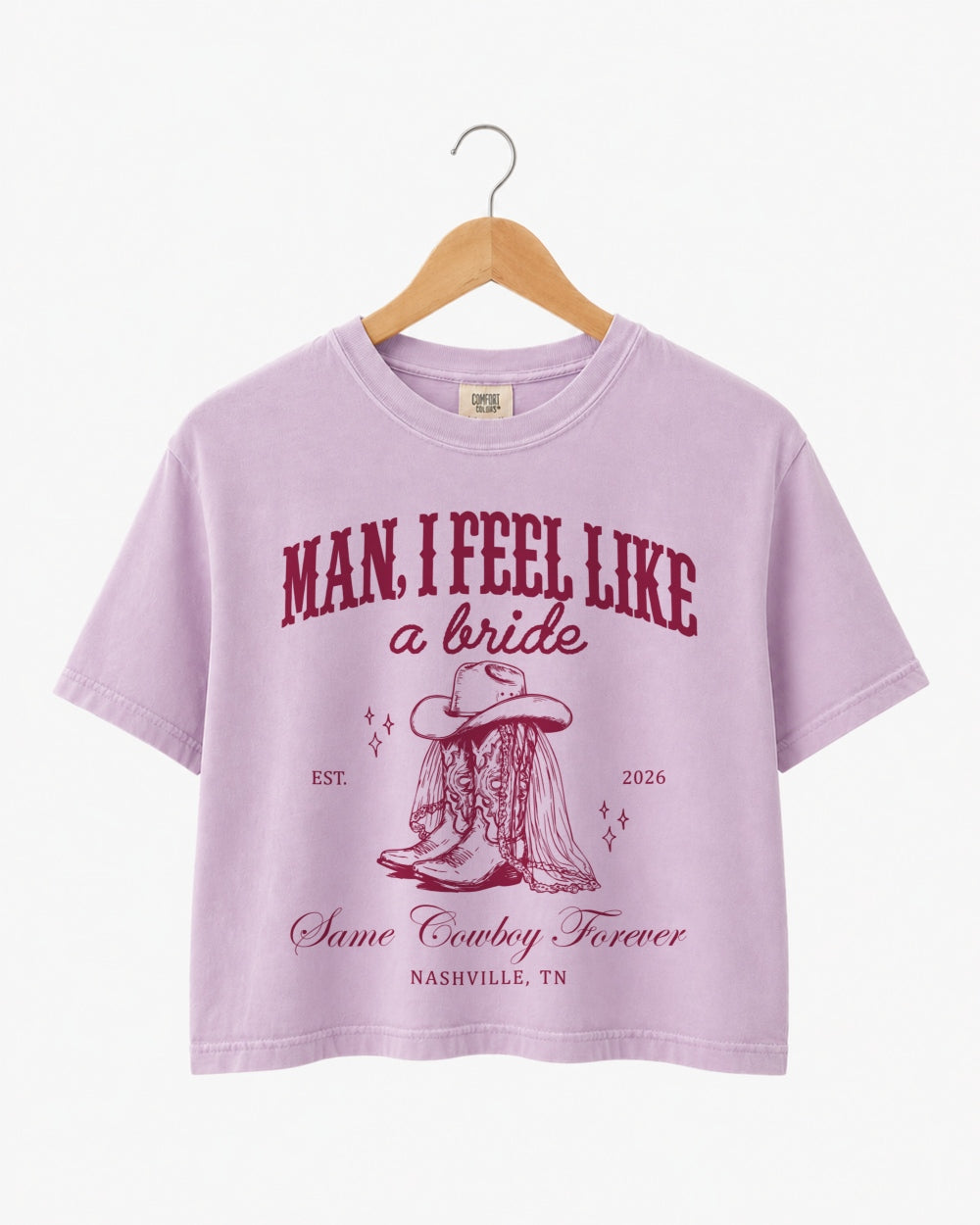 Bride and bridesmaids matching crop tops for a Nashville bachelorette rodeo weekend. Western script design with cowboy boot illustration, personalized with bride name, year, and destination city.
