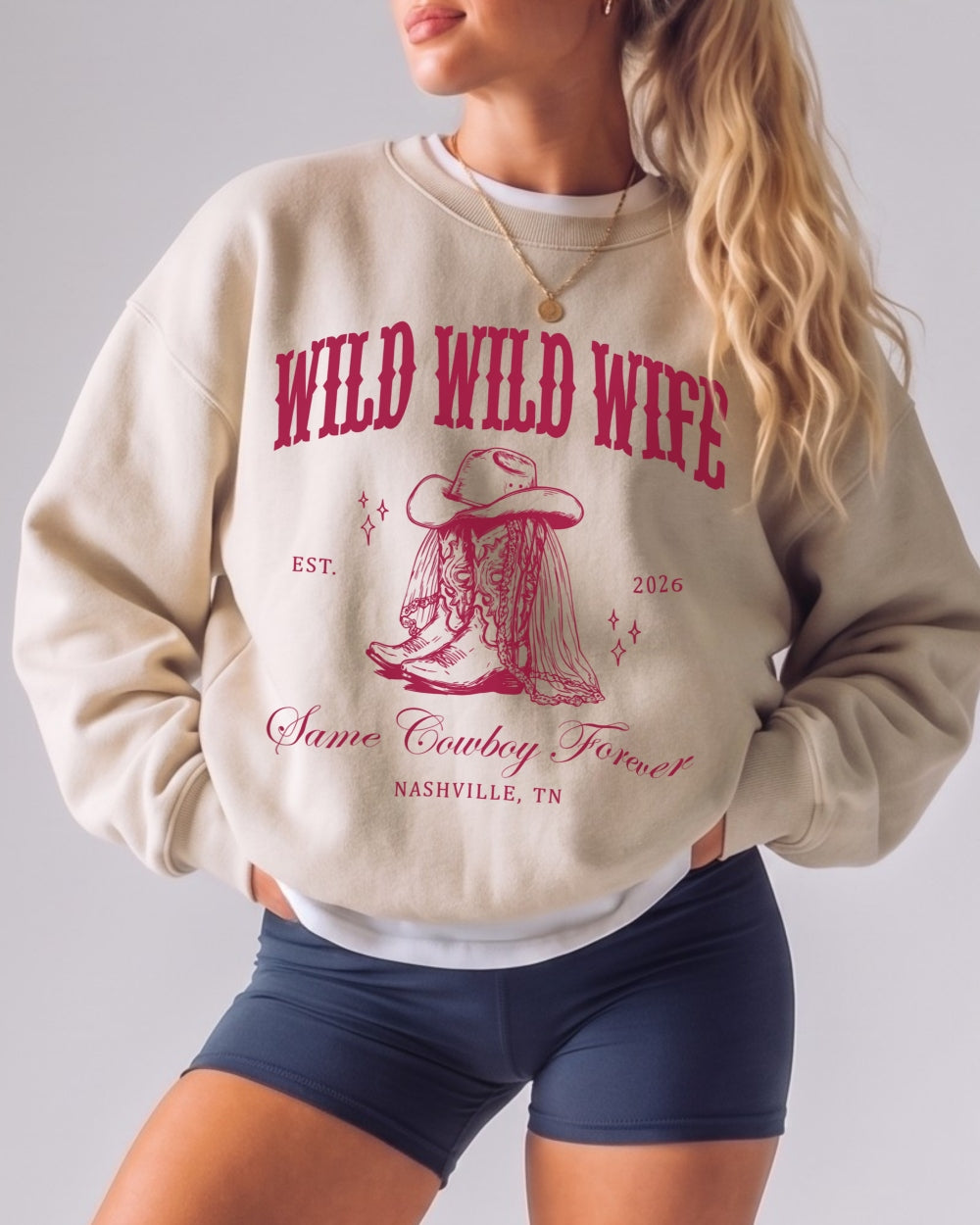 Bachelorette weekend sweatshirt with bold varsity-style western lettering and cowboy boots graphic for the country bride and her crew. Bride name, year, and destination customizable.