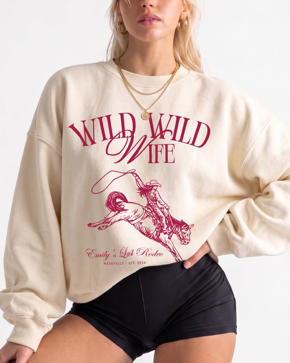 Country western bachelorette sweatshirt with vintage rodeo illustration and Wild Wild Wife script. Bride name, location, and year customizable for the whole bridal crew.