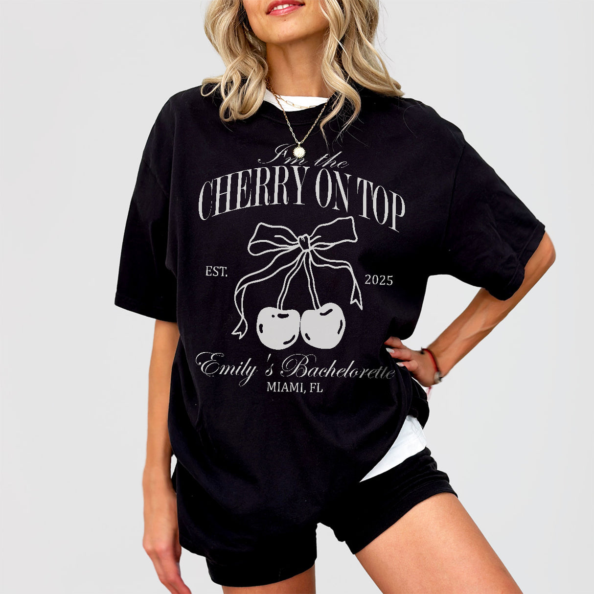 Cute black cotton bachelorette party shirt featuring a cherry design, perfect for the bride-to-be or bridal party celebrating the bride's last fling