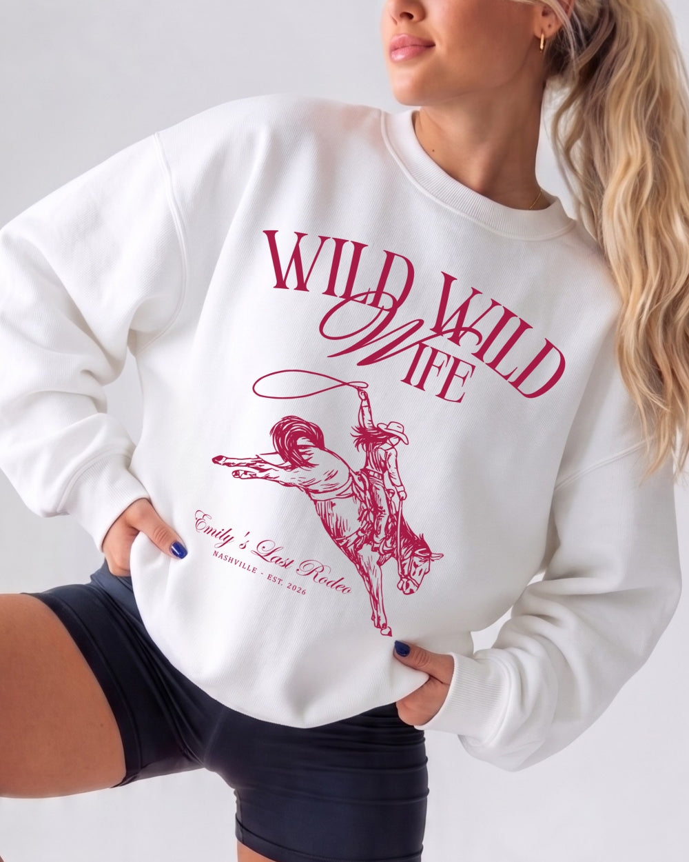 Bride and bridesmaids matching country western sweatshirts for a Wild Wild Wife bachelorette crew. Vintage rodeo theme with location and EST date customizable for the full bridal party.