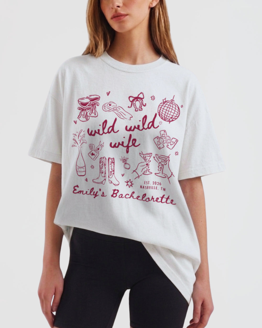Bachelorette weekend tee with whimsical doodle script art for the Wild Wild Wife crew. Personalized with bride name and event details for the whole bridal party.