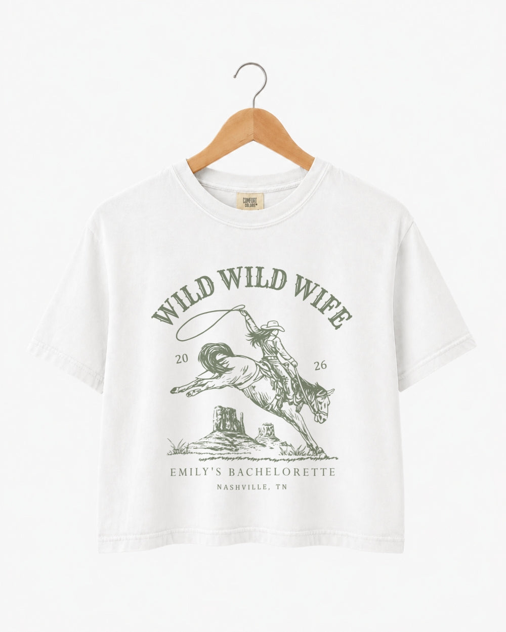 Bachelorette weekend crop top with vintage western rodeo theme for the Wild Wild Wife bride and her crew. Personalized with bride name, date, and destination city.