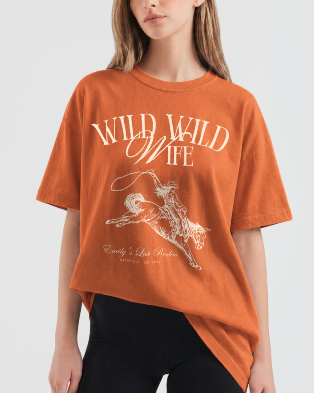 Gift idea for the western bride: Wild Wild Wife bachelorette T-shirt with vintage rodeo illustration and script lettering. Perfect for the bride squad heading to a country concert or ranch weekend.