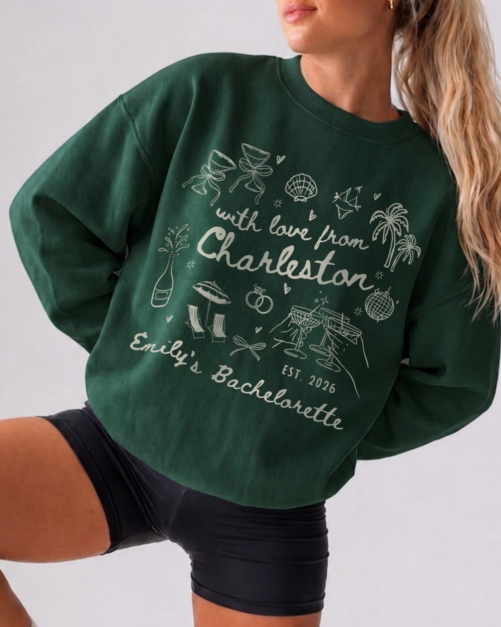 Crew sweatshirt bachelorette style with playful line-art doodles and script lettering. Personalized with bride name, city, and year for the whole bachelorette crew.
