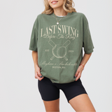 Moss green premium cotton bachelorette t-shirt featuring 'Last Swing Party' design, available in sizes S, M, L from Relatee.