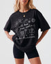 Bride and bridesmaids matching bachelorette tees with whimsical line-art doodles and script typography. Personalized with the bride's name, city, and year for the whole crew.