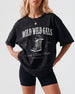 Bride and bridesmaids matching country bachelorette t-shirts with vintage western boot illustration and Wild Wild Wife script. Personalized with bride name, year, and hometown for the whole crew.
