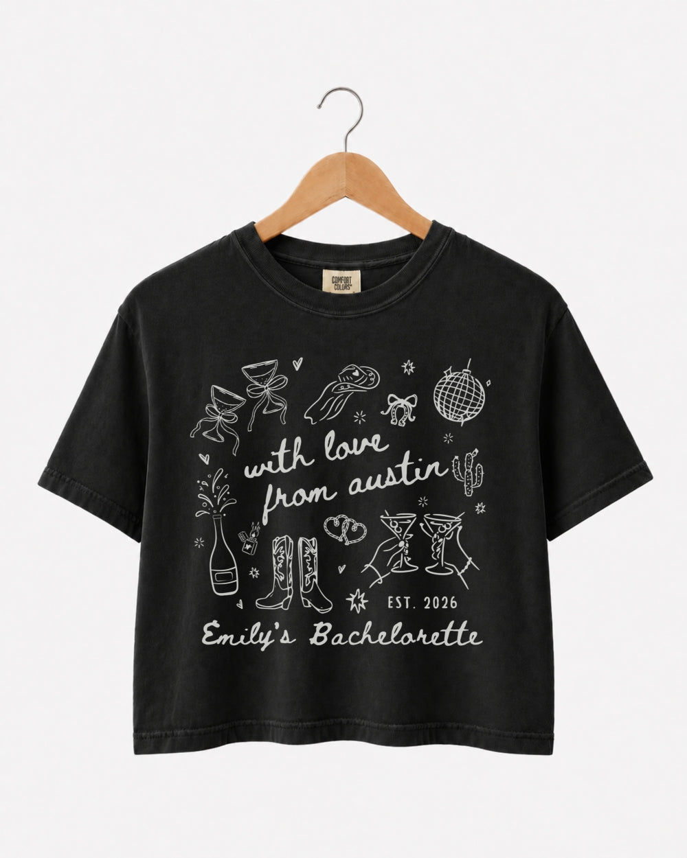 Matching crop tops for the bachelorette crew with minimalist doodle script and Austin destination theme. Personalized with bride name, year, and city for the whole party.