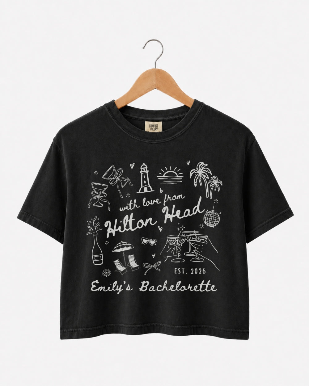 Matching crop tops for the bachelorette crew with playful line-art doodles and hand-drawn script. Personalized with bride name, destination, and EST year for any beach or coastal weekend getaway.