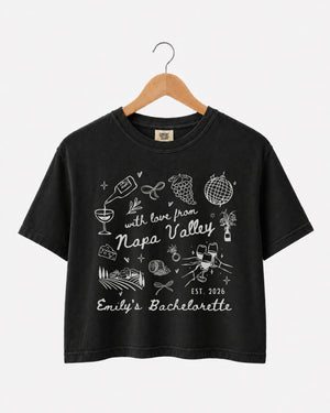 Matching crop tops for the Napa Valley bachelorette crew, whimsical wine-country doodle art with script lettering. Personalized with bride name, year, and destination for the full bridal party.