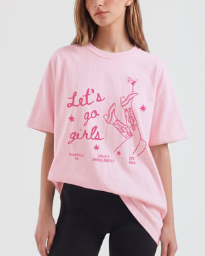 Vintage line-art girls night out tee with script lettering, cowboy boots, and martini graphics. Retro-illustrated Let's Go Girls design for bachelorette parties, girls trips, and weekend crew outings.
