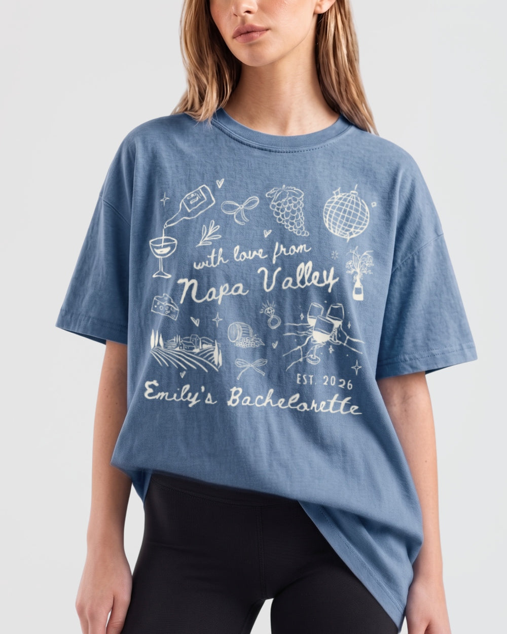 Gift idea for a Napa Valley bachelorette crew: whimsical sketch-art tee with wine country illustrations, personalized with bride name, date, and destination for the whole party.