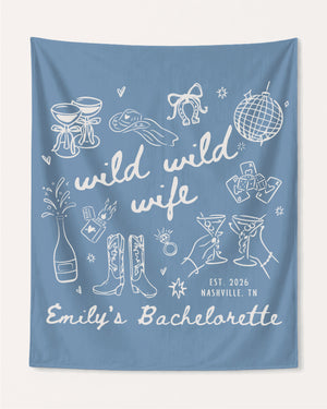 Bachelorette party banner gift idea with Wild Wild Wife theme and playful hand-drawn line art. Personalized with bride name, year, and destination city for the whole crew.