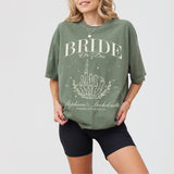 Moss green cotton shirt with "Bride Or Die" skeleton bride design, perfect for a gothic or Halloween bachelorette party favor