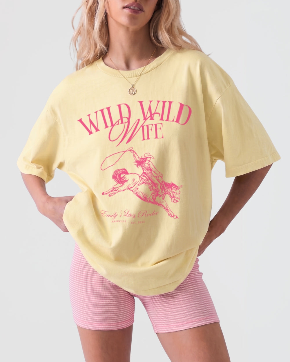 Matching western bachelorette T-shirts for the Wild Wild Wife rodeo bride crew. Vintage cowgirl illustration with bold script lettering, perfect for a western-themed bachelorette party weekend.