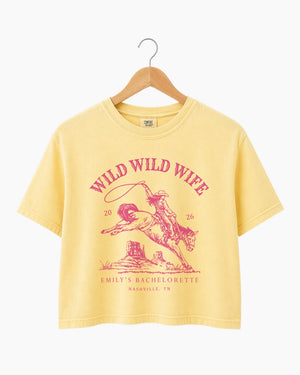 Personalized bachelorette crop top with bride name, year, and city on a vintage western rodeo design. Custom Wild Wild Wife cowgirl theme for the whole bridal crew.