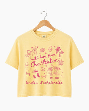 Personalized bachelorette crop top with destination city, bride name, and wedding year in hand-drawn doodle script. Custom matching set for the whole crew, perfect for a girls trip or bachelorette weekend.