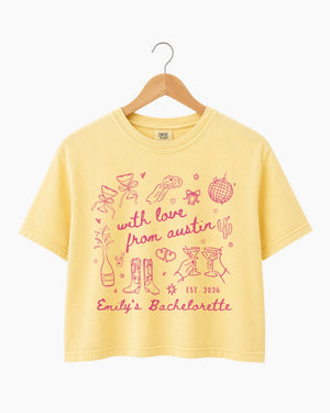 Personalized bachelorette crop top with bride name, EST year, and hometown city in minimalist doodle script. Custom matching set for the whole bridal crew.