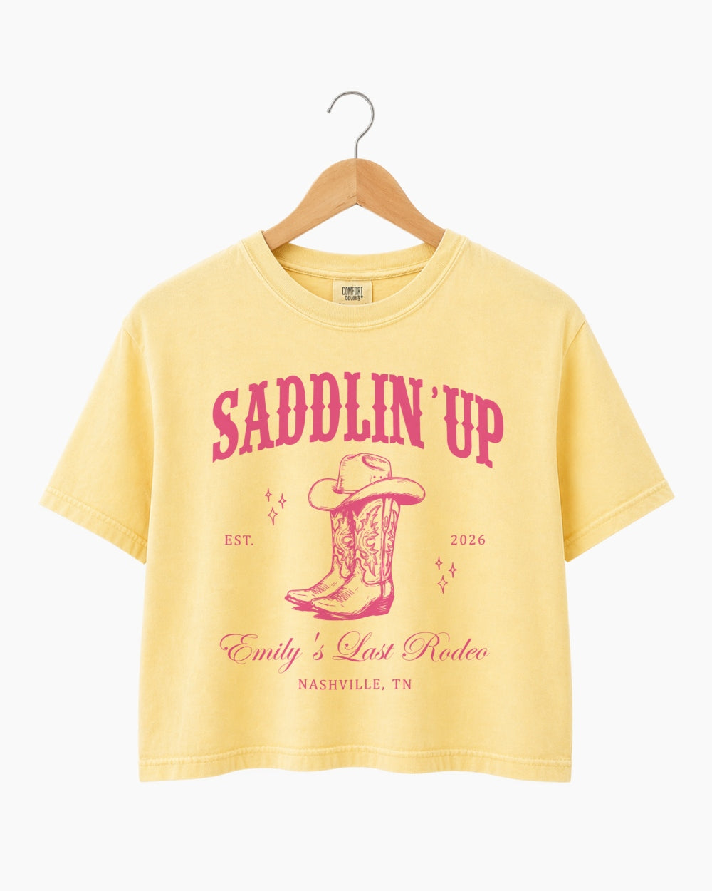 Personalized rodeo bachelorette crop top with bride name, established year, and city on a vintage western Last Rodeo design. Custom matching set for the whole bachelorette crew.