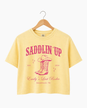 Personalized rodeo bachelorette crop top with bride name, established year, and city on a vintage western Last Rodeo design. Custom matching set for the whole bachelorette crew.