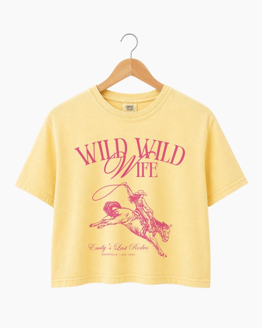 Personalized bachelorette crop top with bride name, date, and city on a vintage western rodeo design. Custom matching set for the Wild Wild Wife crew and her Last Rodeo weekend.