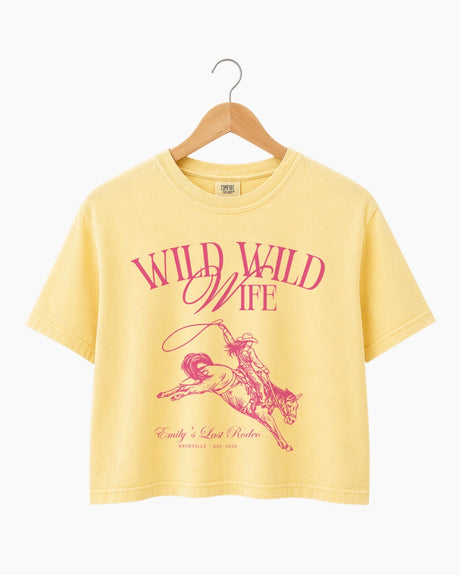 Personalized bachelorette crop top with bride name, date, and city on a vintage western rodeo design. Custom matching set for the Wild Wild Wife crew and her Last Rodeo weekend.