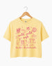 Personalized bachelorette crop top with bride name, date, and city on a Wild Wild Wife doodle design. Playful script lettering and line-art icons for the whole bachelorette crew.