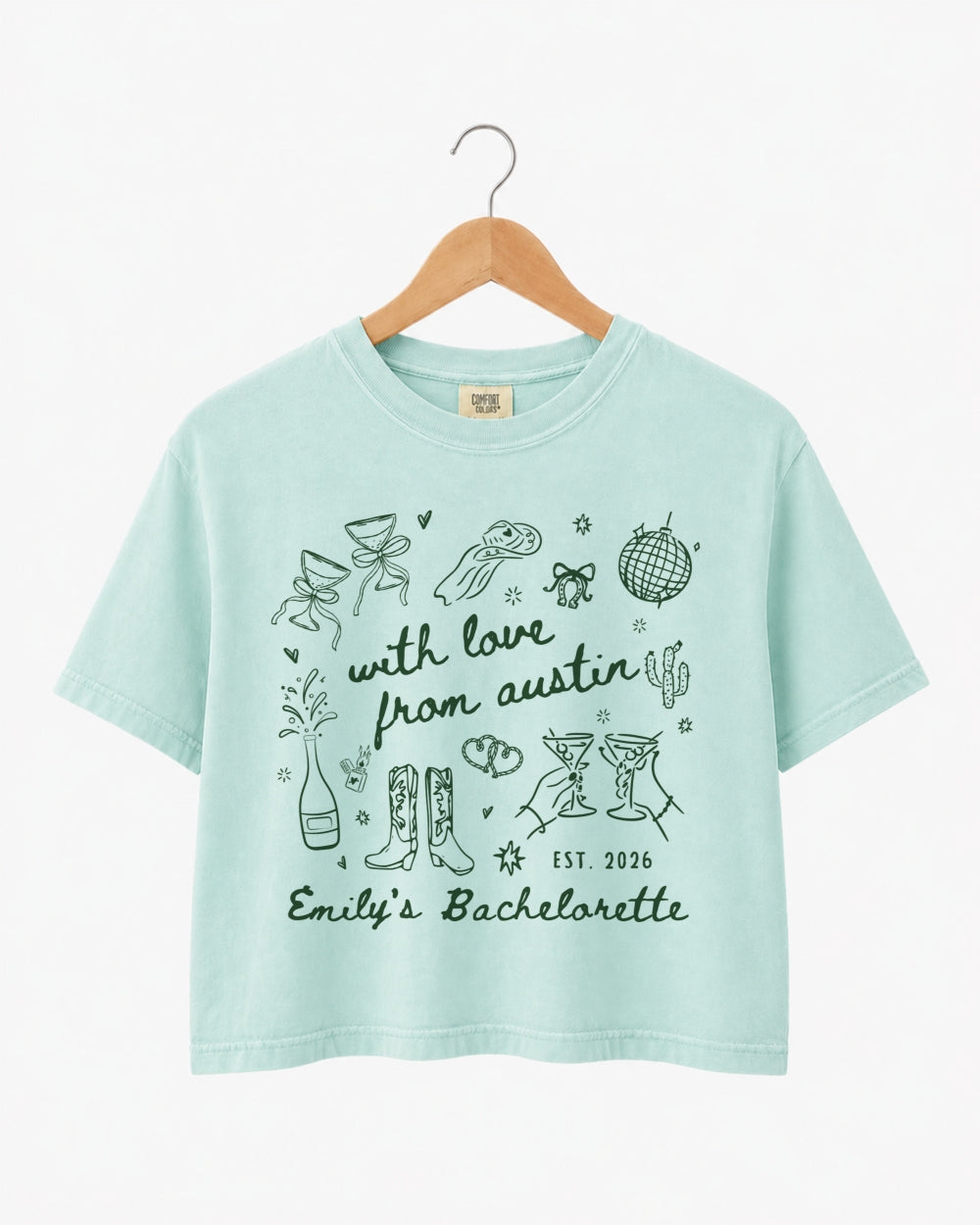 Gift idea for the bachelorette crew: Austin-themed crop top with minimalist doodle script art. Personalized with bride name, party year, and city for the whole group.