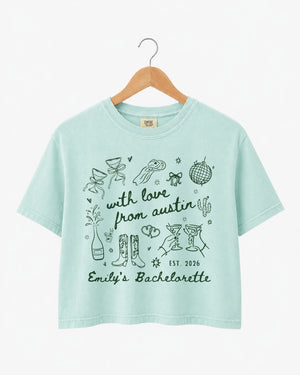 Gift idea for the bachelorette crew: Austin-themed crop top with minimalist doodle script art. Personalized with bride name, party year, and city for the whole group.