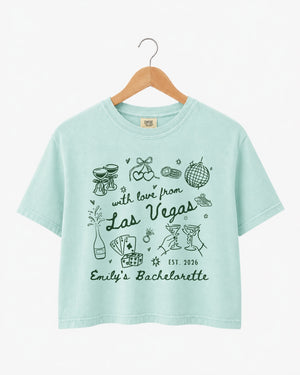 Gift idea for the Las Vegas bachelorette crew: vintage-art crop tops with bride name, year, and city customizable. Perfect bridesmaid proposal or bridal shower gift for a Vegas weekend.