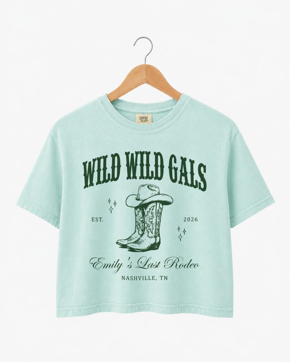 Personalized bachelorette crop top with bride name, est. year, and destination city on a vintage western cowgirl design. Custom matching set for the Wild Wild Wife crew and her bridesmaids.