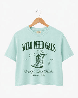 Personalized bachelorette crop top with bride name, est. year, and destination city on a vintage western cowgirl design. Custom matching set for the Wild Wild Wife crew and her bridesmaids.