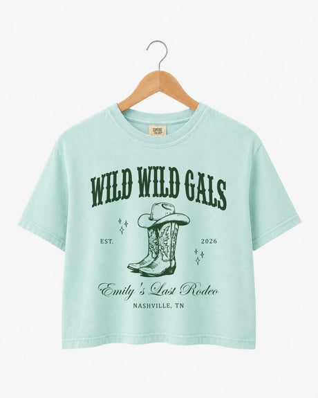 Personalized bachelorette crop top with bride name, est. year, and destination city on a vintage western cowgirl design. Custom matching set for the Wild Wild Wife crew and her bridesmaids.