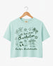Gift idea for the bride-to-be: Charleston bachelorette crop top with hand-drawn doodle script and playful icons. Personalized with bride name, destination city, and EST year for the whole crew.