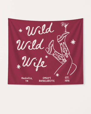 Bachelorette weekend party banner with Wild Wild Wife cowgirl and martini theme. Personalized with bride name, destination city, and year for the full celebration setup.