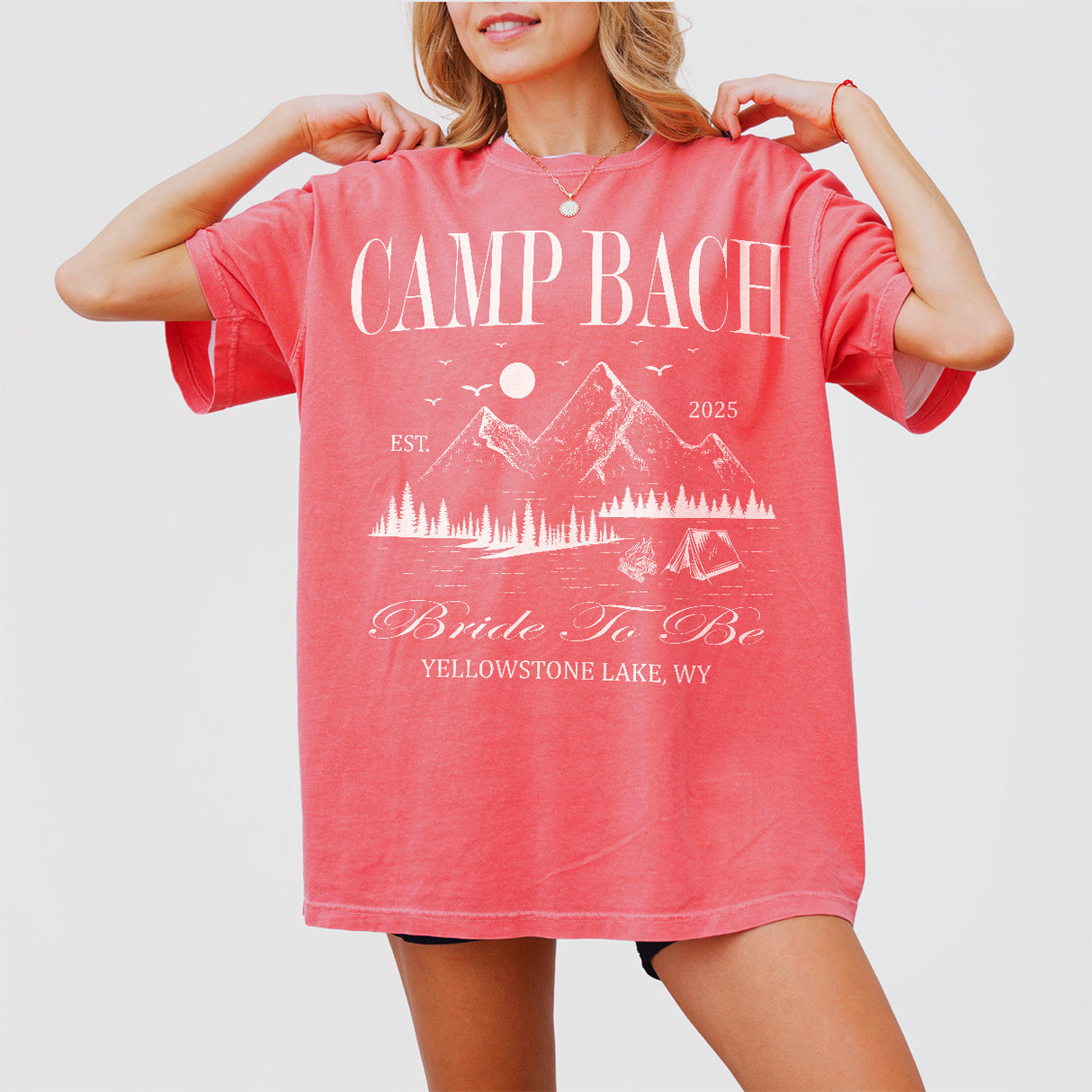 Women wearing a personalized bachelorette t-shirt with Camp Bach and mountain design.