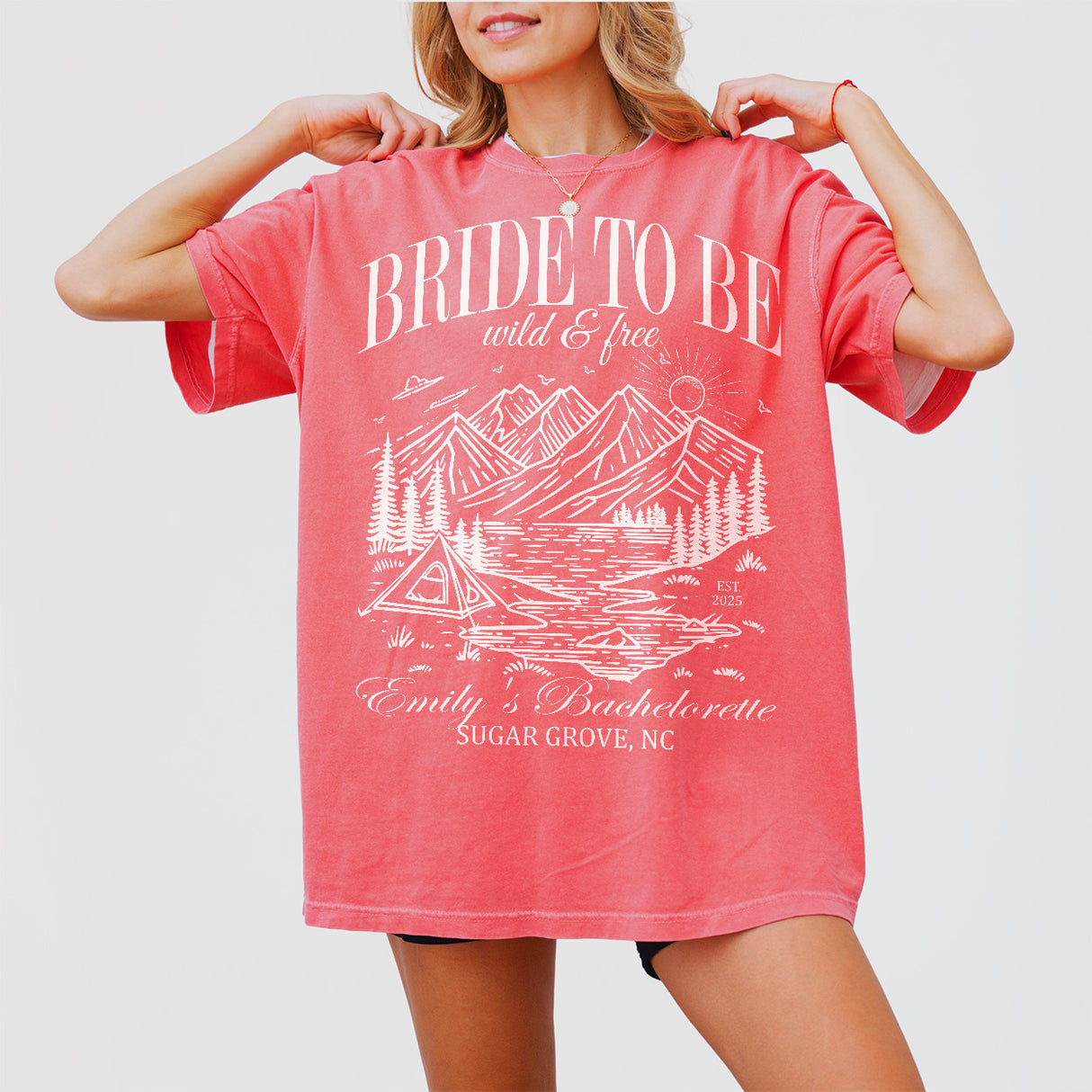 Watermelon red shirts for bachelorette camping, featuring a mountain design and "Last Trail Before the Veil" text for the bride-to-be